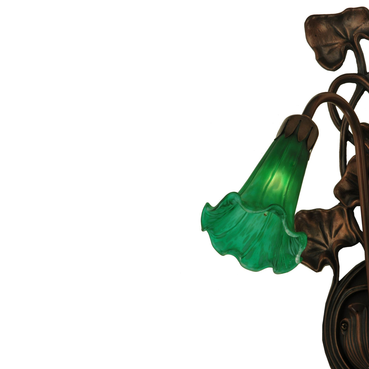 Close-up of green glass shade on pond lily wall sconce.