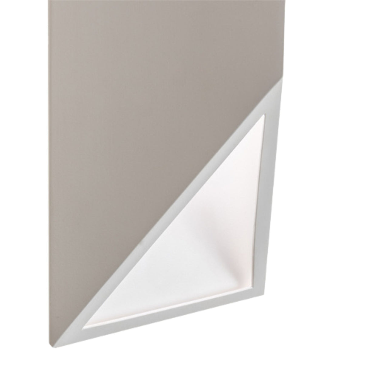 Close-up of the lower triangular cutout of the Cillian wall sconce with white light.