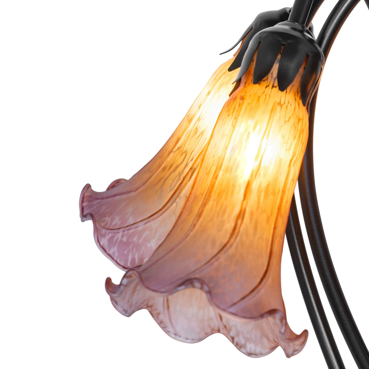 Detailed design of amber and purple glass shades on tiffany lamp.