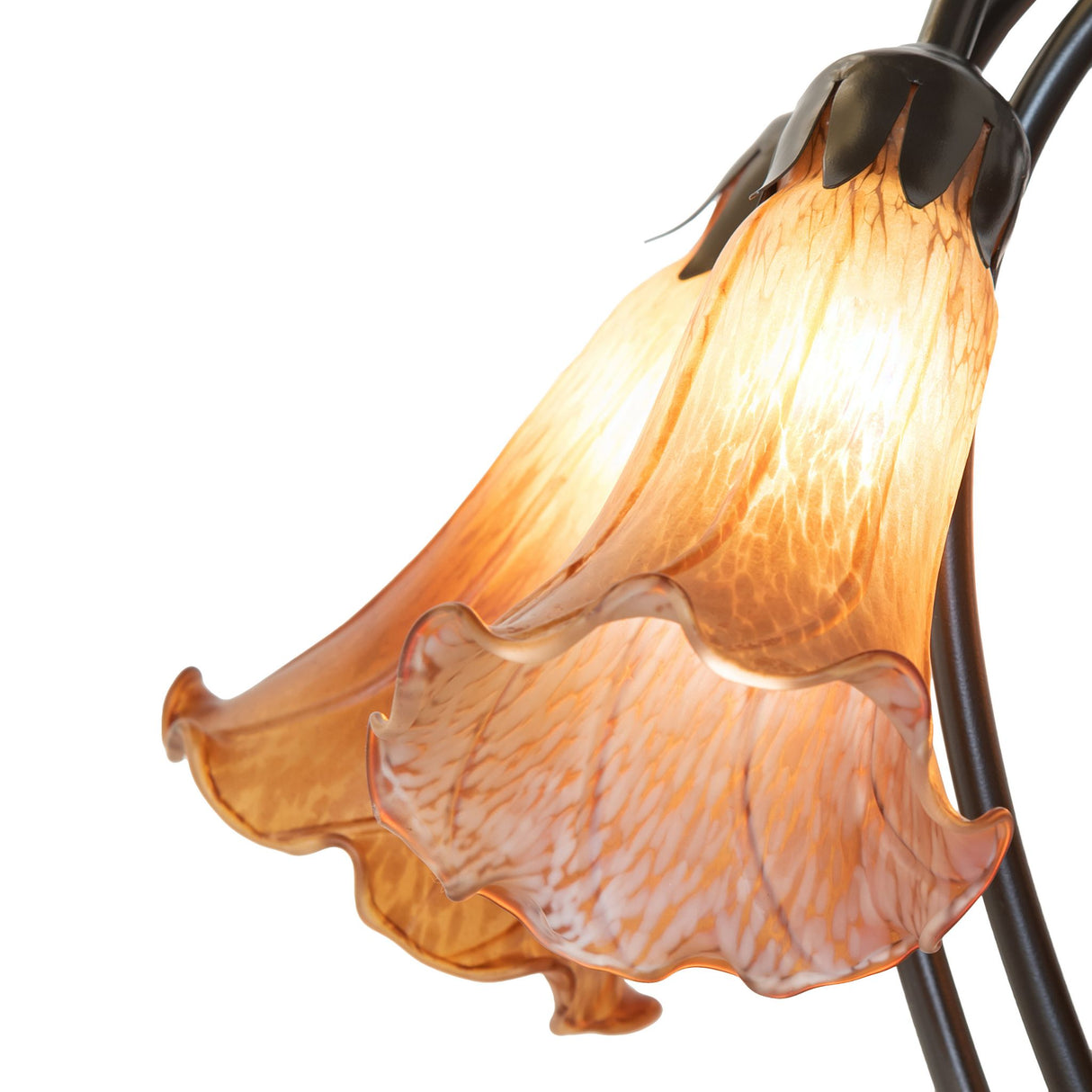 Detailed design of amber glass shades on tiffany lamp.