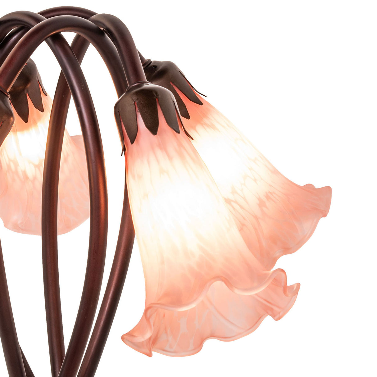 Close-up of glowing pink glass shades on the Tiffany pond lily lamp.