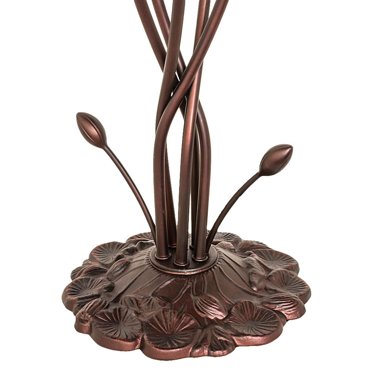 Detailed shot of lamp base with artistic floral design.