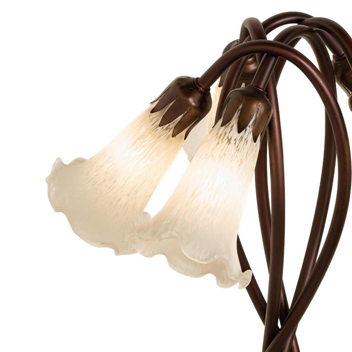 Close-up of glowing white glass shades on the Tiffany pond lily lamp.