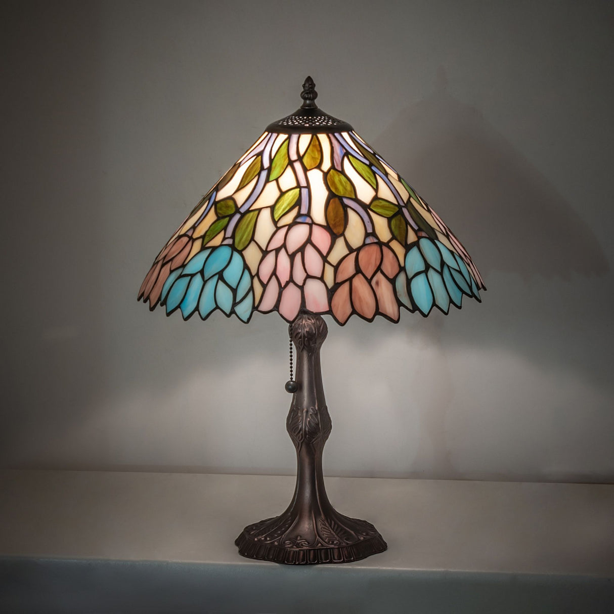 19" High Wisteria Table Lamp lit in an ambient setting with soft light.