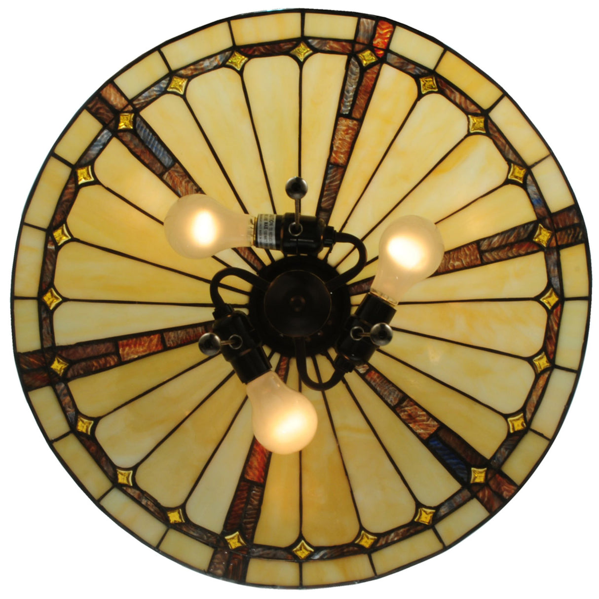 Top view of a circular stained glass pendant with glowing cream and amber panels.