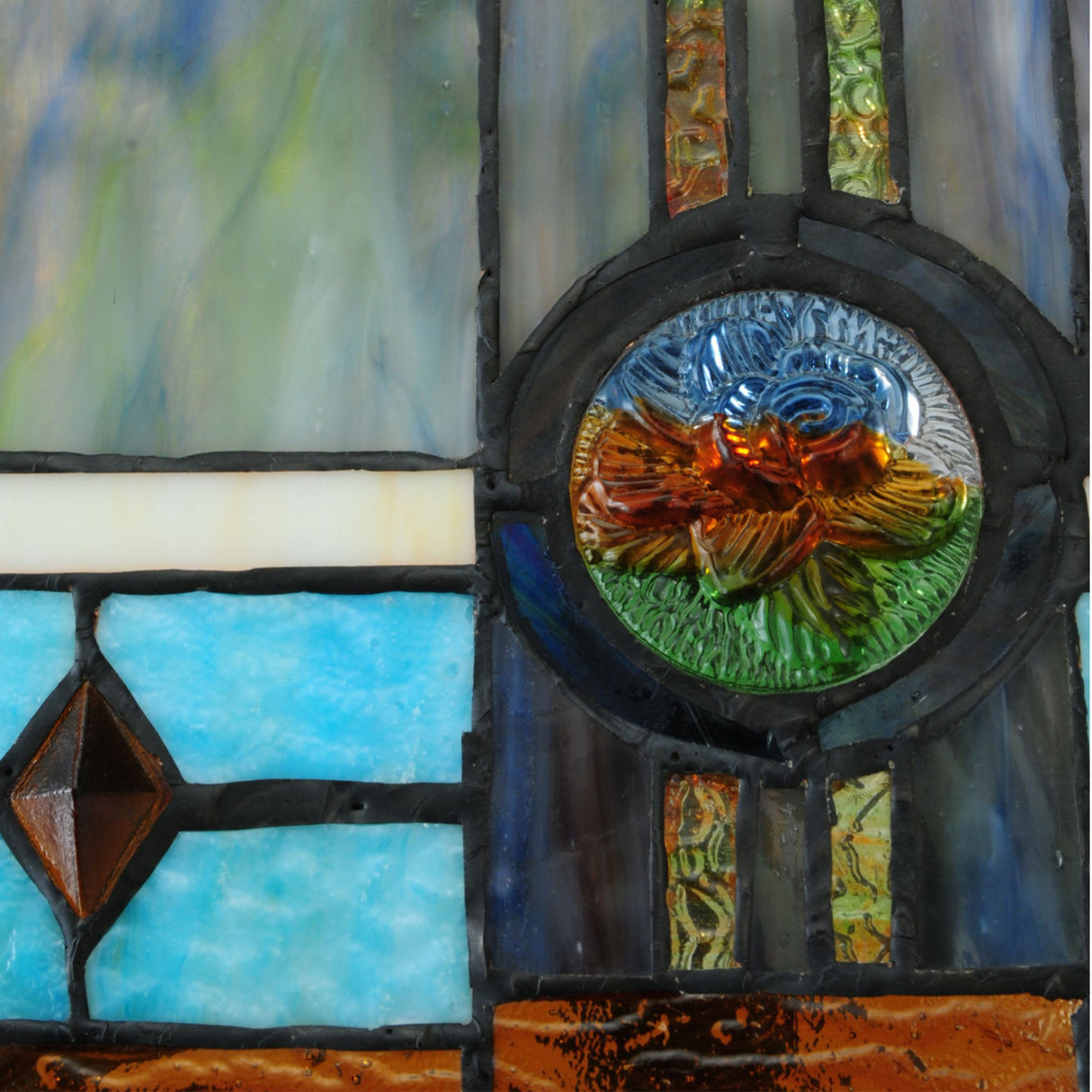 Close-up of Mission Rose table lamp stained glass with floral design.