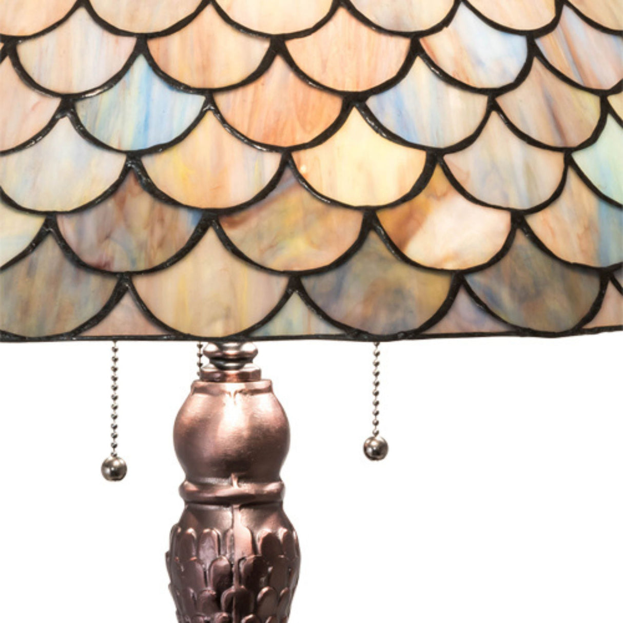 Close-up of Tiffany Fishscale lamp shade with colorful stained glass details.
