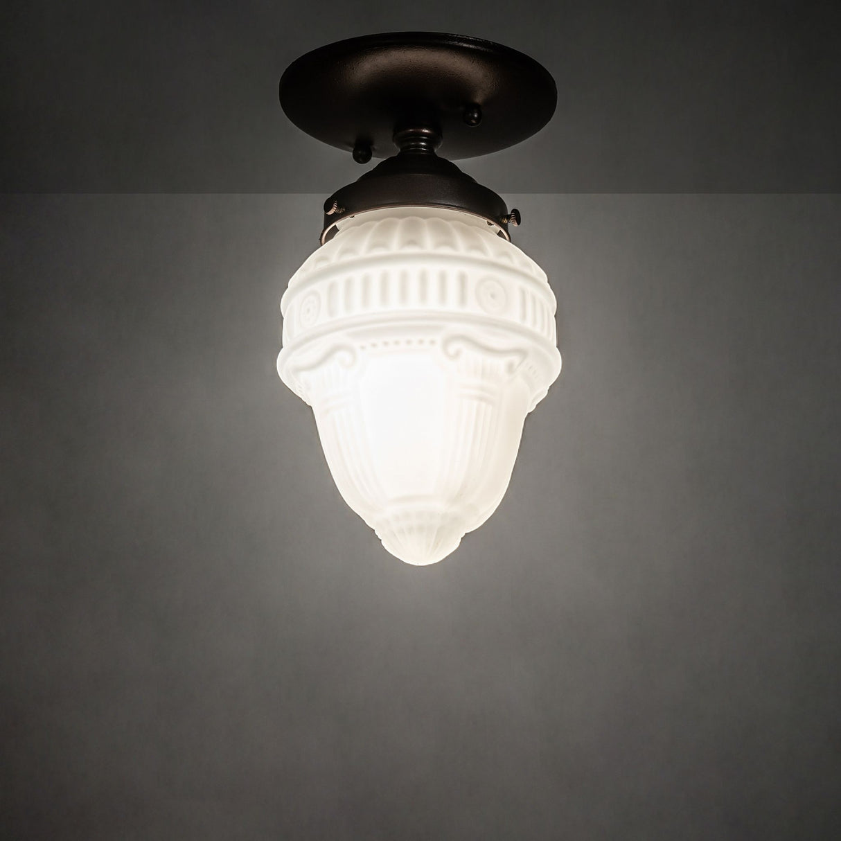 Illuminated Colonnade flushmount light fixture.