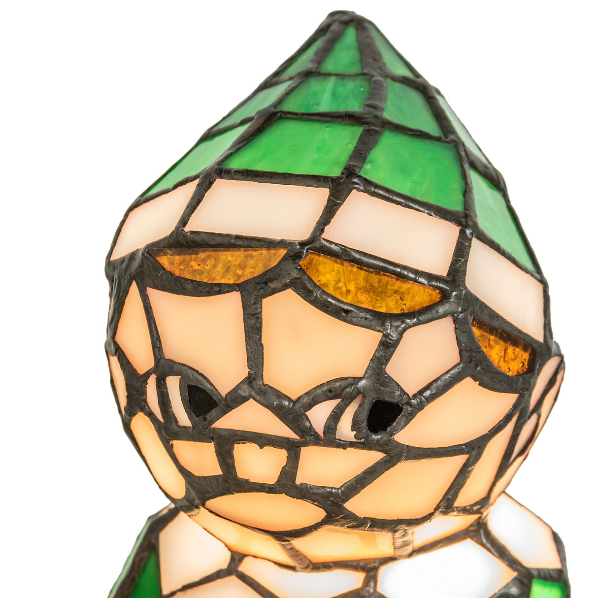 Close-up of elf lamp with warm glass texture, face detail