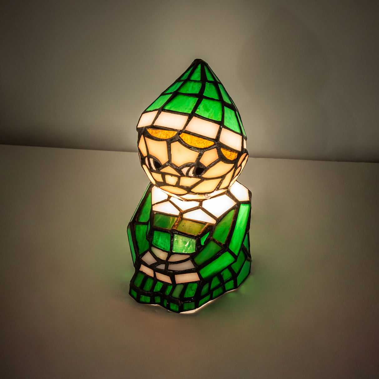 Elf accent lamp glowing in a dimly lit room.