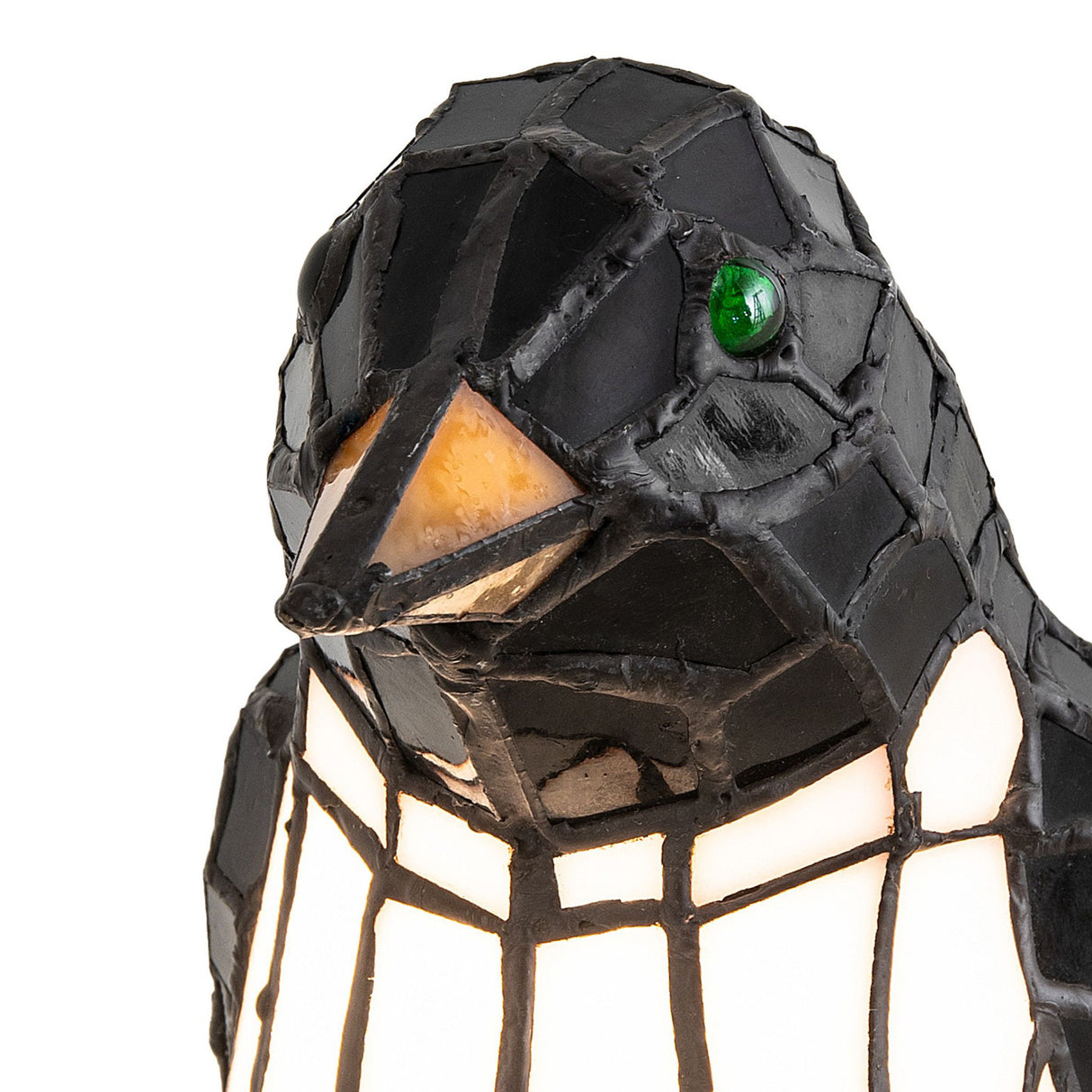 Close-up of penguin accent lamp head.