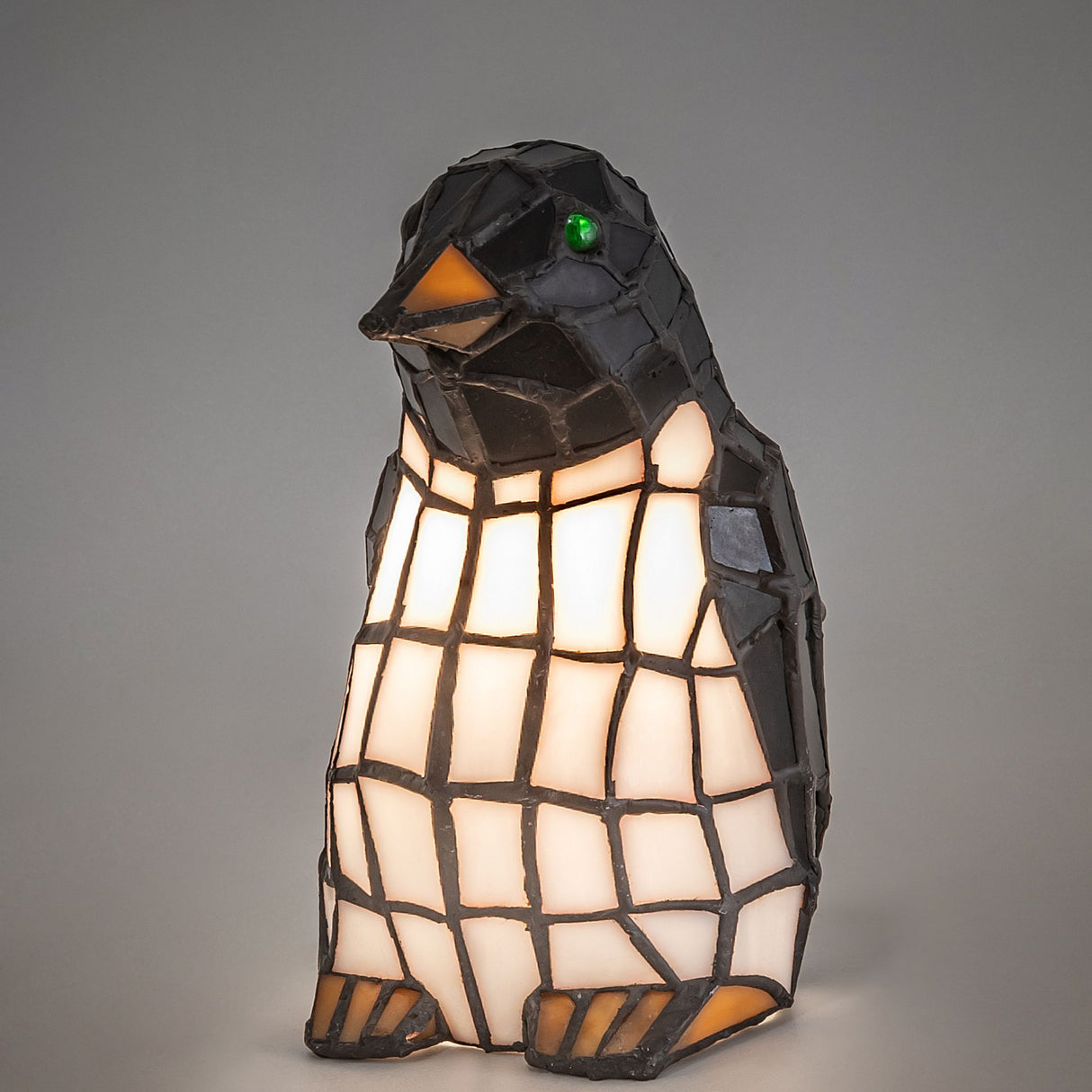 Penguin accent lamp glowing with light.
