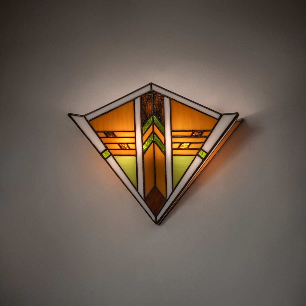 Illuminated Abilene wall sconce with warm amber tones.