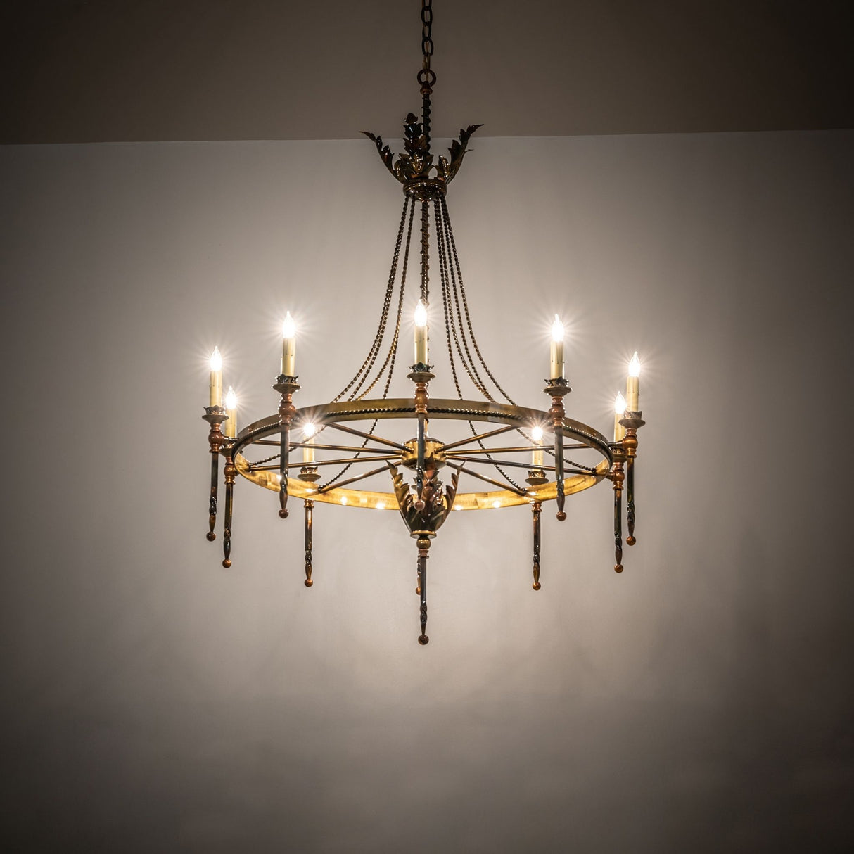 Amaury chandelier casting warm ambient light in traditional interior.