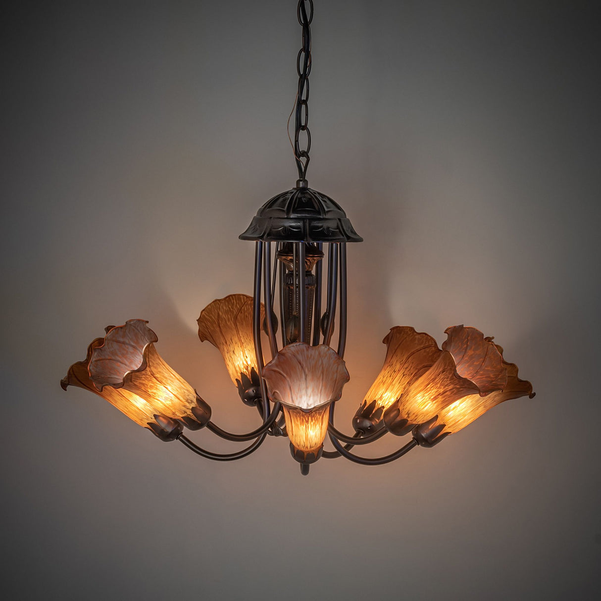 Illuminated Amber Tiffany Pond Lily Chandelier showcasing 7 stunning amber shades.