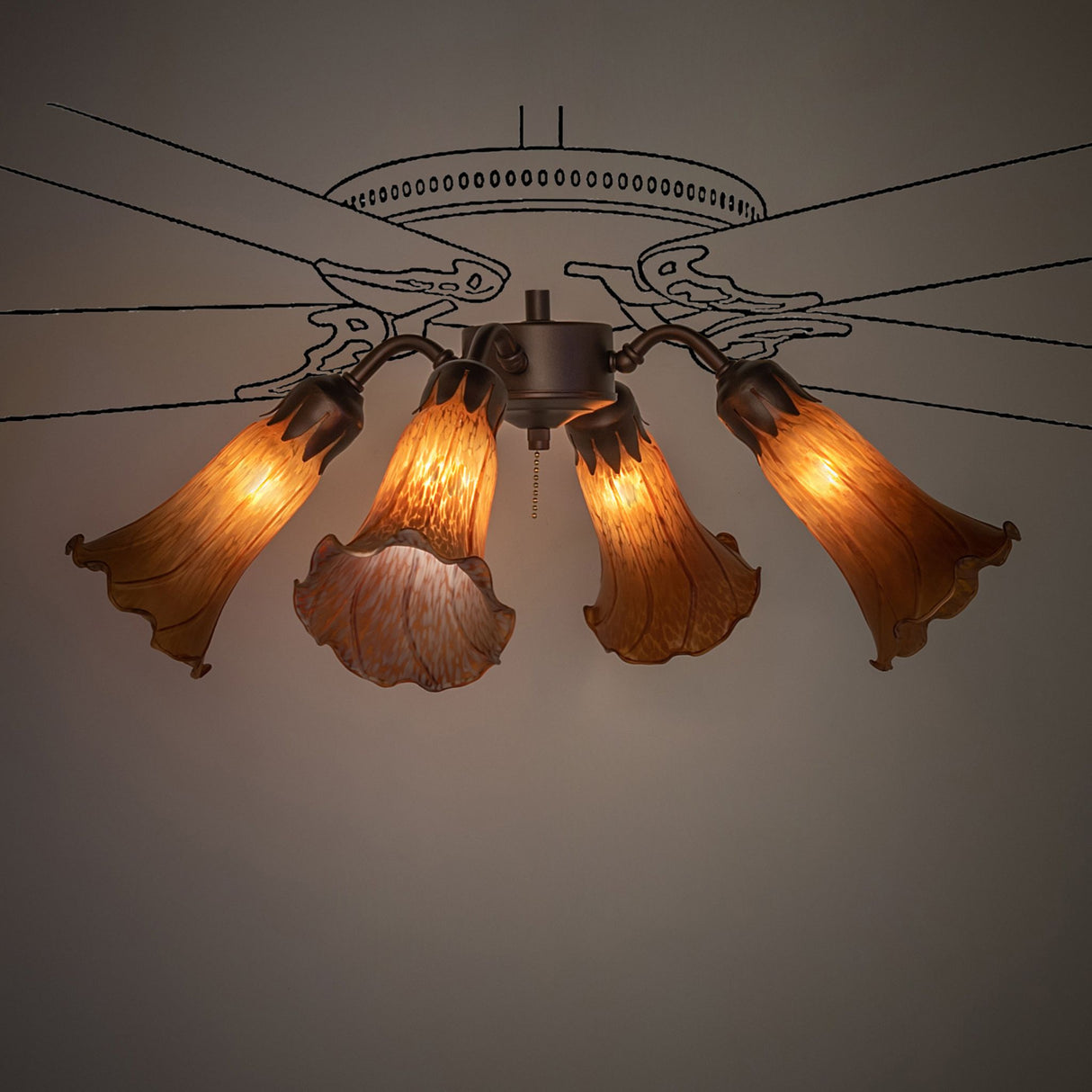 Amber Tiffany Pond Lily fan light, fully lit with warm glow.