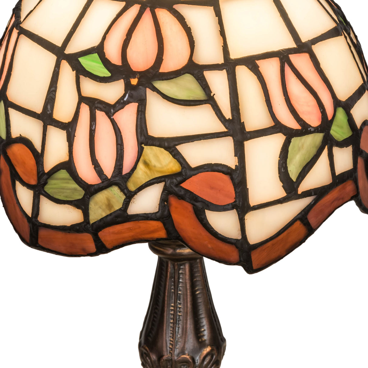 Detailed view of the Roseborder mini lamp’s floral glass design and bronze base.