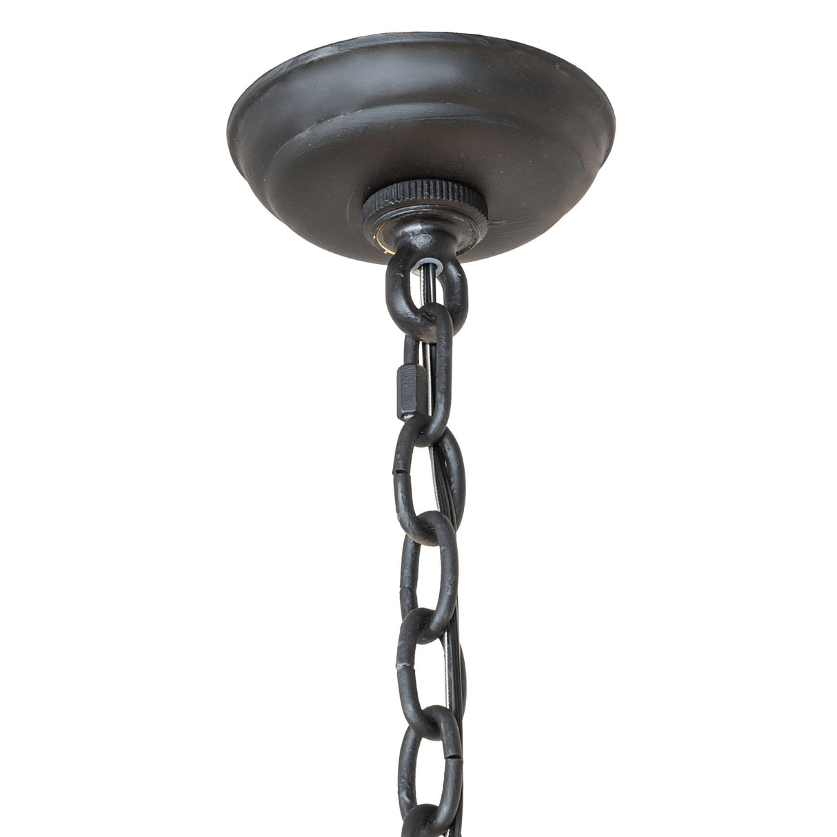Ceiling canopy of chandelier showing round metal canopy, chain connection, and wiring detail.