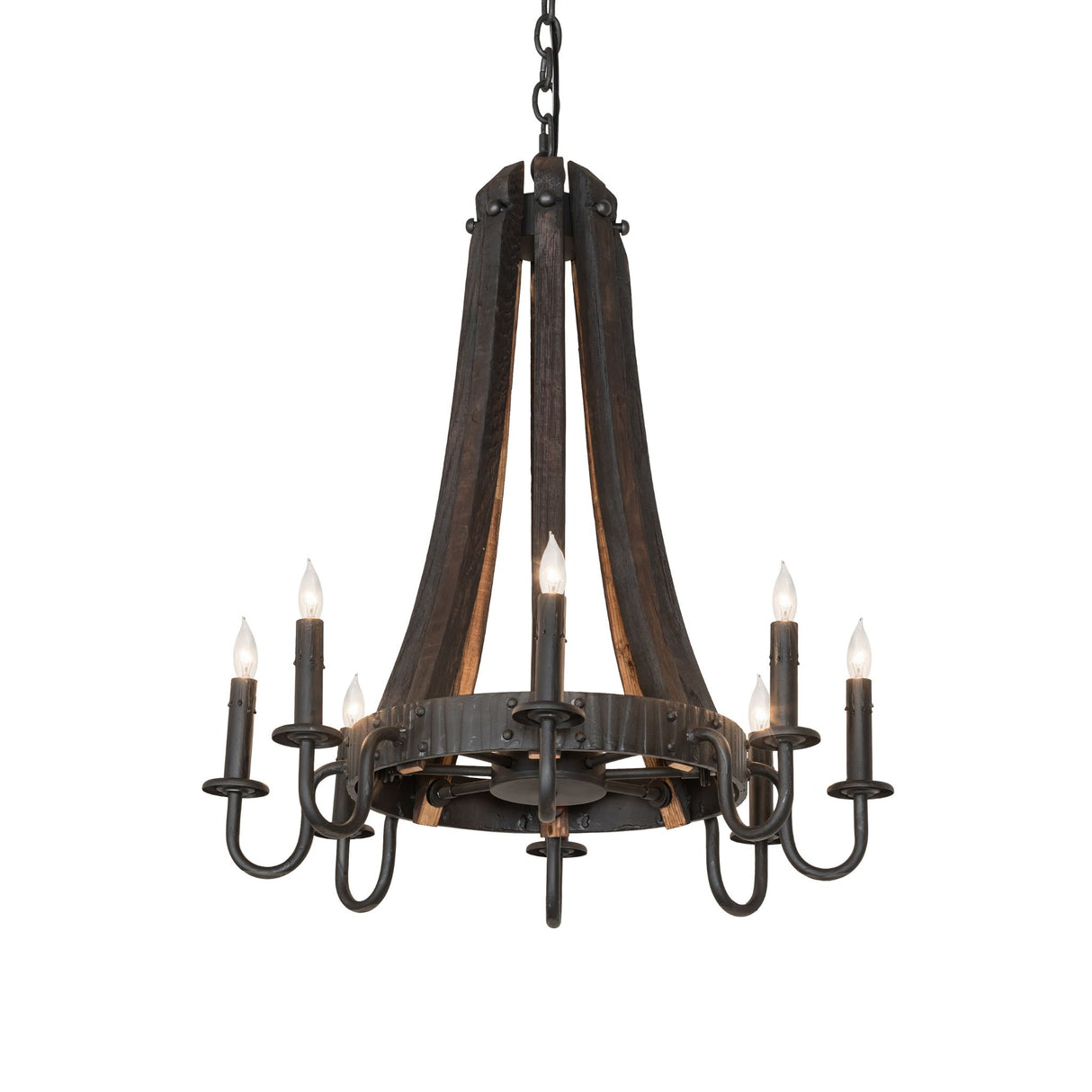 Lit view of chandelier featuring charred wood staves, black metal arms, and glowing candle lights.