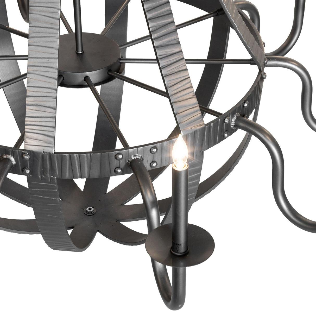 Detailed view of candlelight with holder and hammered metal bands.