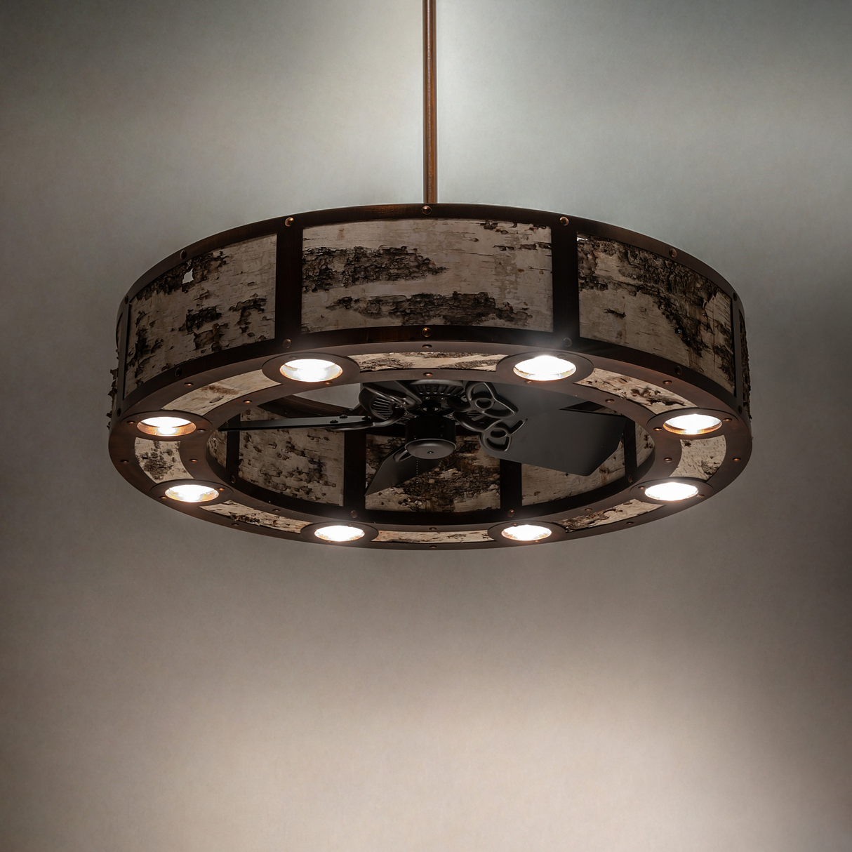 Lit view of Birchwood Chandel-Air highlighting rustic birchwood panels and warm glow.