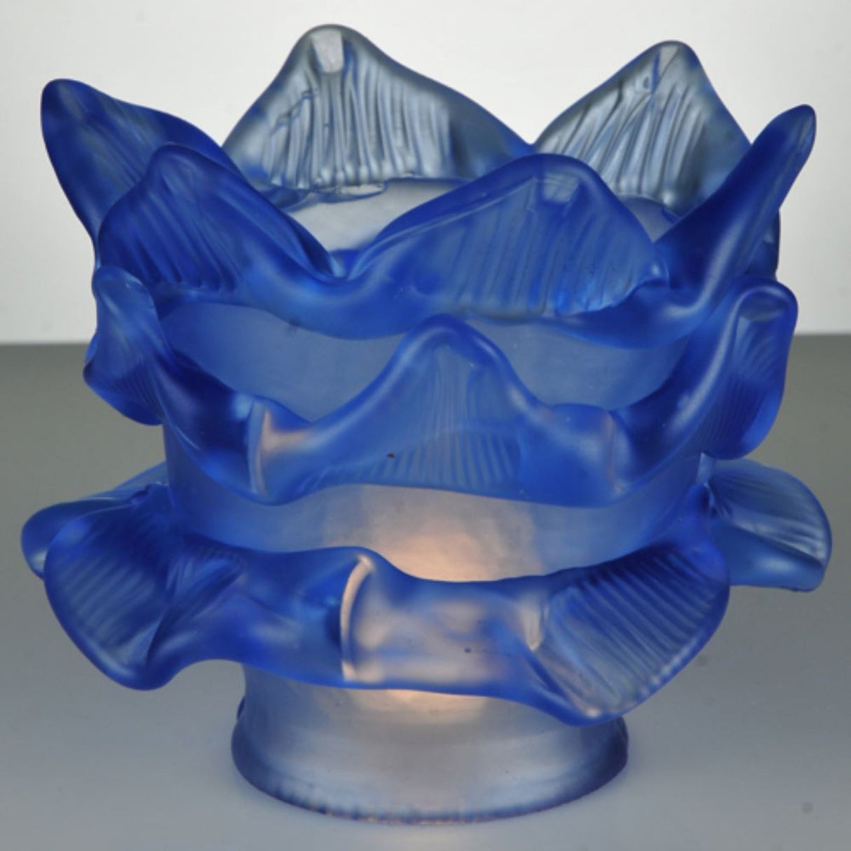 Elegant blue floral glass shade with intricate layered petal design.