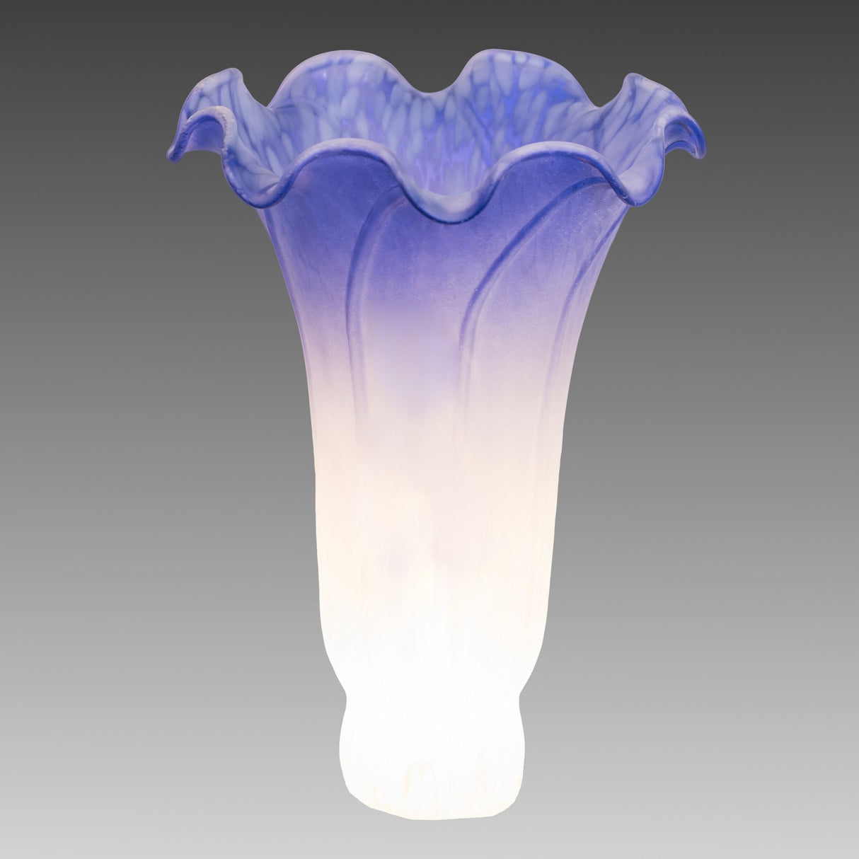 Ambient view of glowing blue and white pond lily glass shade.