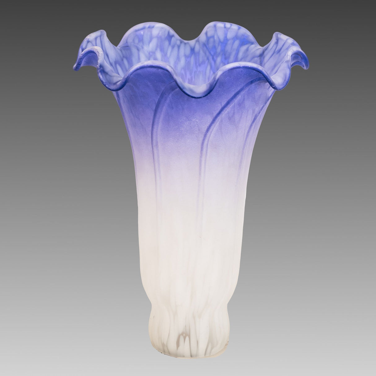 Unlit view of handcrafted blue and white lily glass shade.