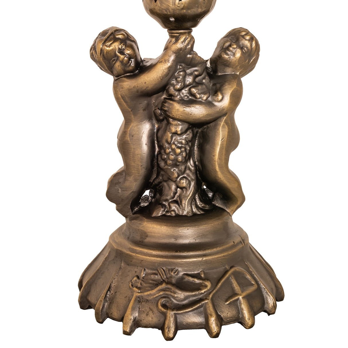Closeup of cast bronze cherub base with antique brass finish.