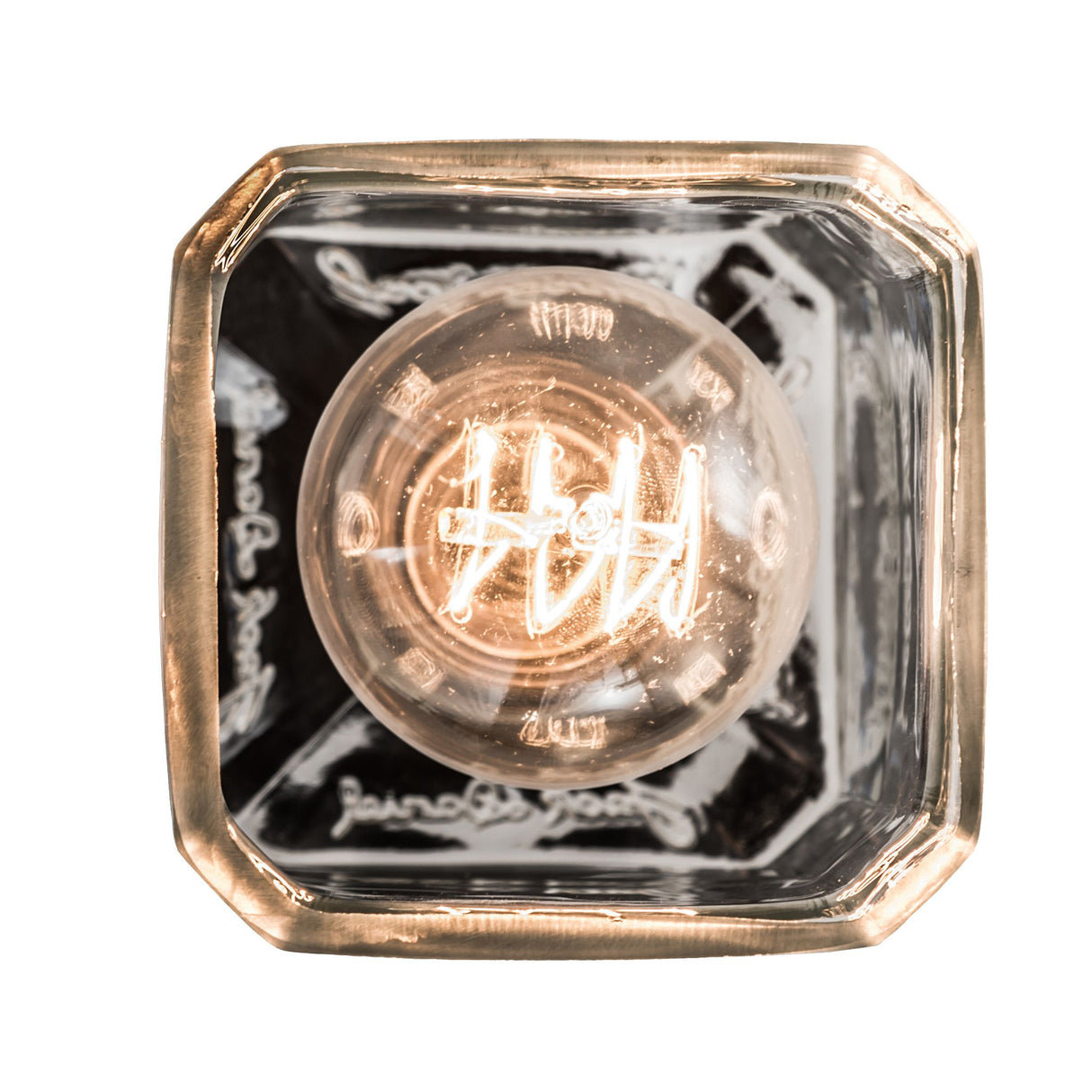 Bottom view of bourbon bottle pendant showcasing bulb filaments.