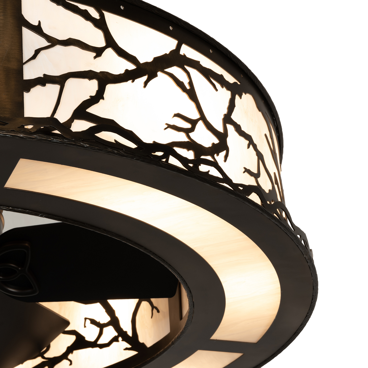 Closeup showing intricate branch motif and softly glowing Idalight shade.