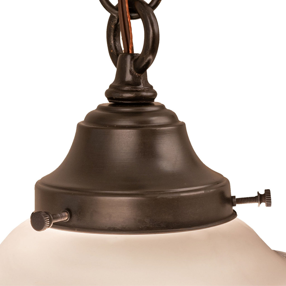 Close-up of the pendant light's bronze hardware and mounting ring.