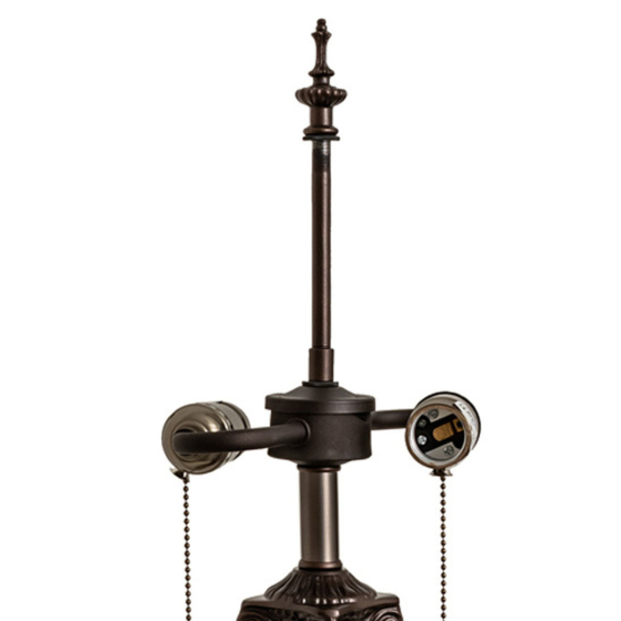 Close-up of bronze lamp base top with finial and dual sockets.