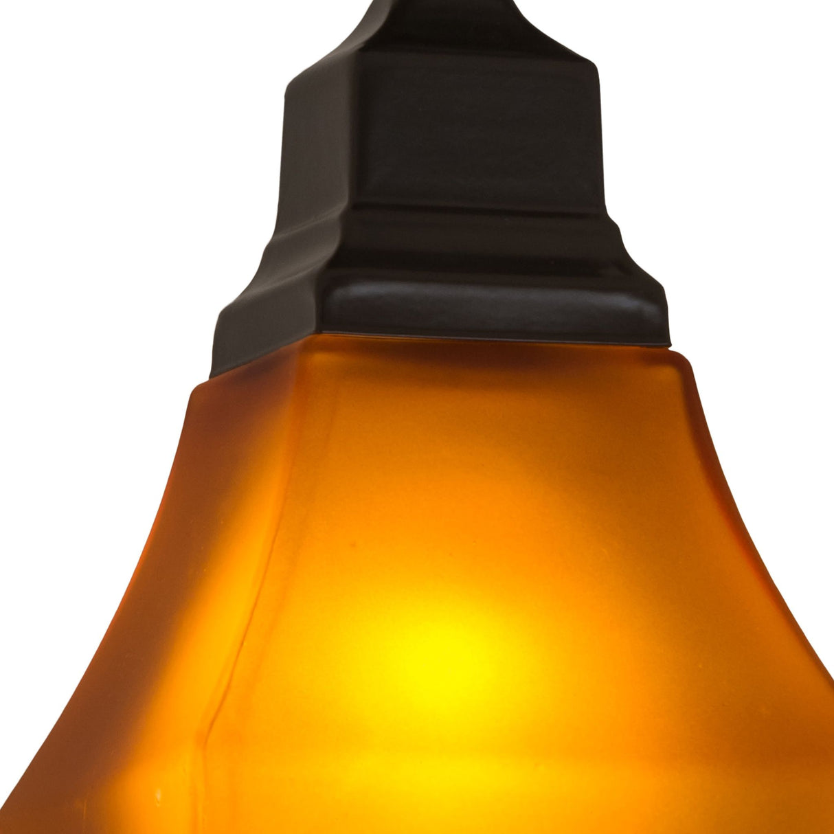 Close-up of amber glass shade and bronze base.