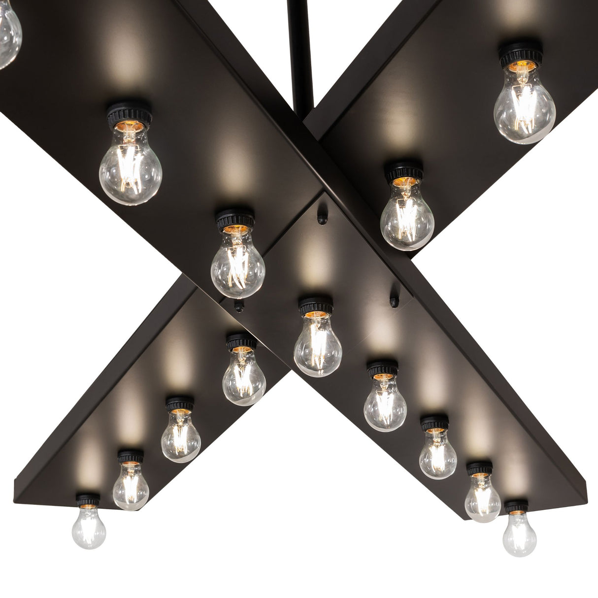 Detail of criss cross metal bars and Edison bulbs on Caldero chandelier.