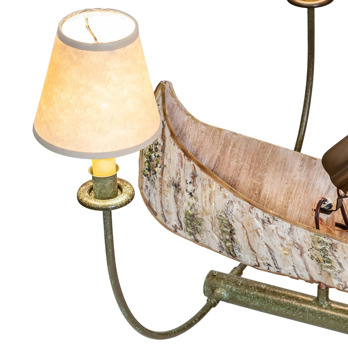Close-up of fabric shade and curved metal arm showing refined rustic craftsmanship.