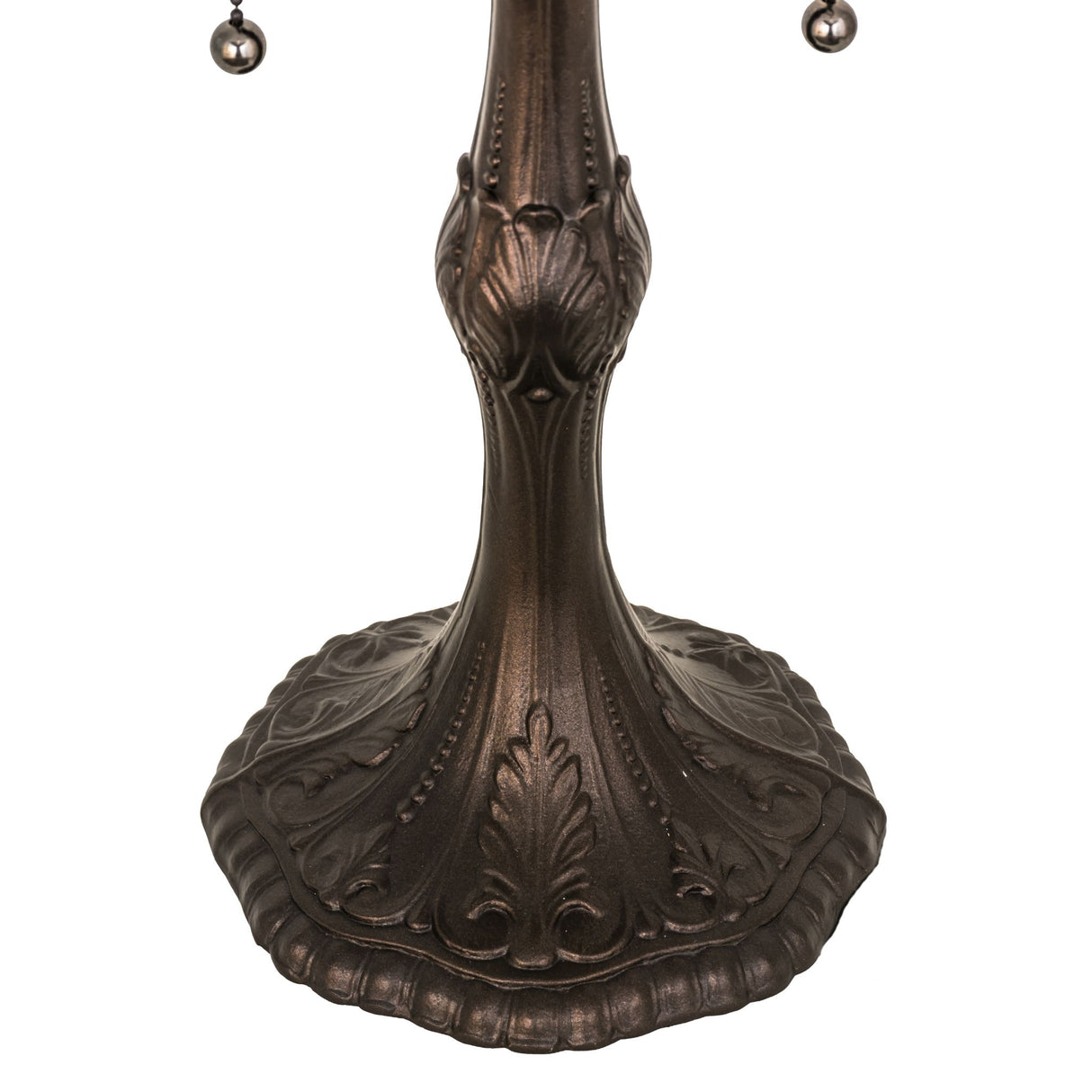 Close-up of Capri table base with intricate leaf-inspired detailing in a dark bronze finish.