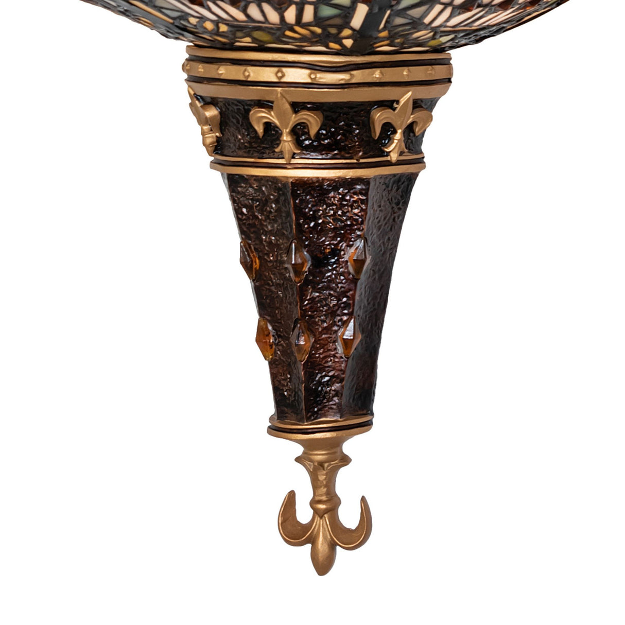 Close-up of the Fleur-de-lis wall sconce base featuring textured bronze and amber accents.