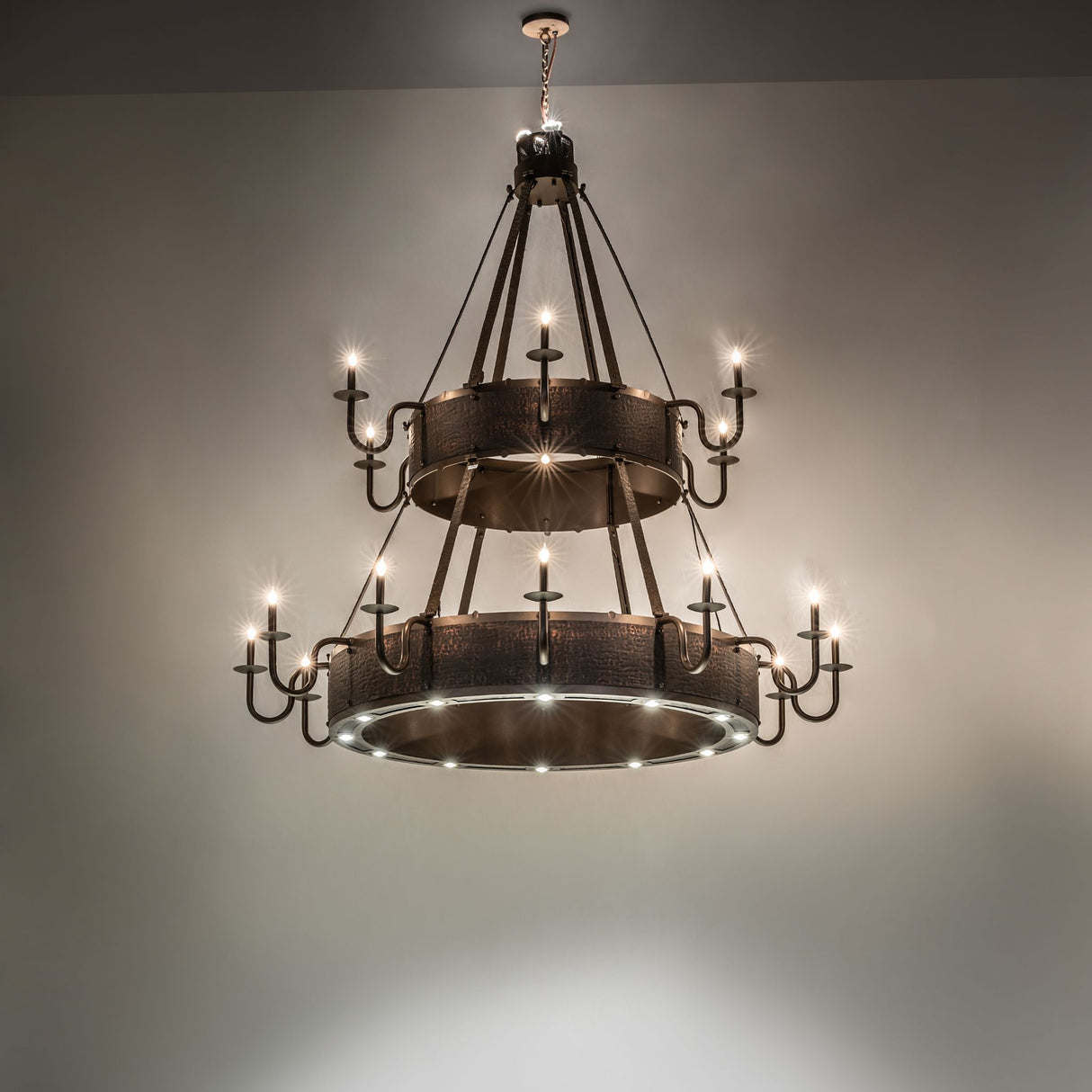Room display of the Costello two-tier chandelier glowing with layered lighting.