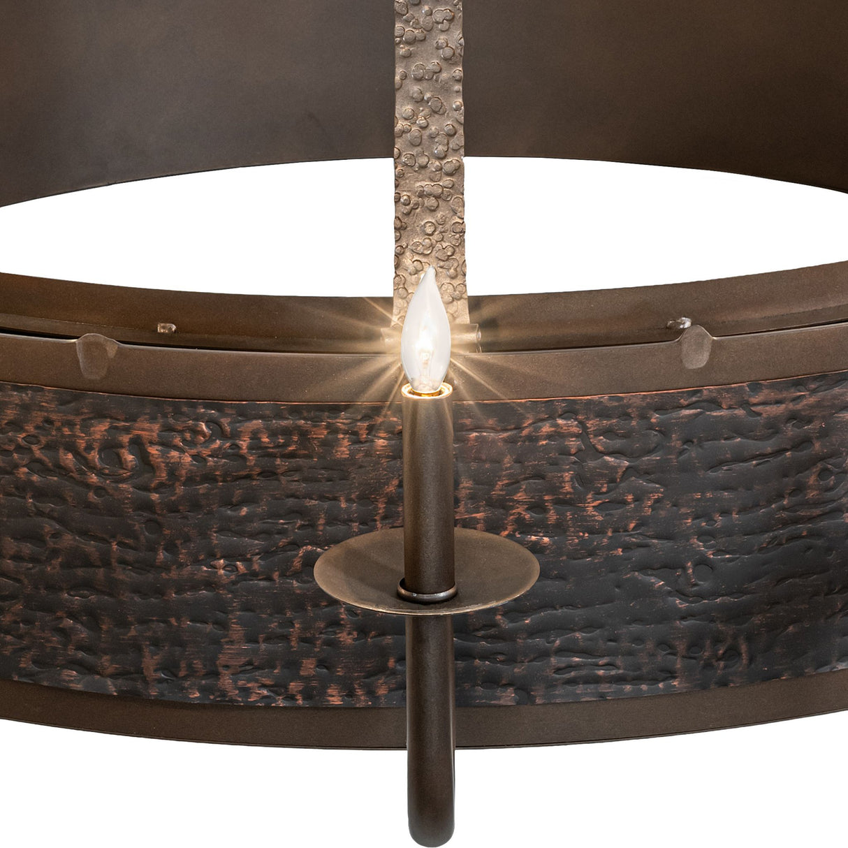 Single candle light closeup showing flame-style bulb and hardware texture.