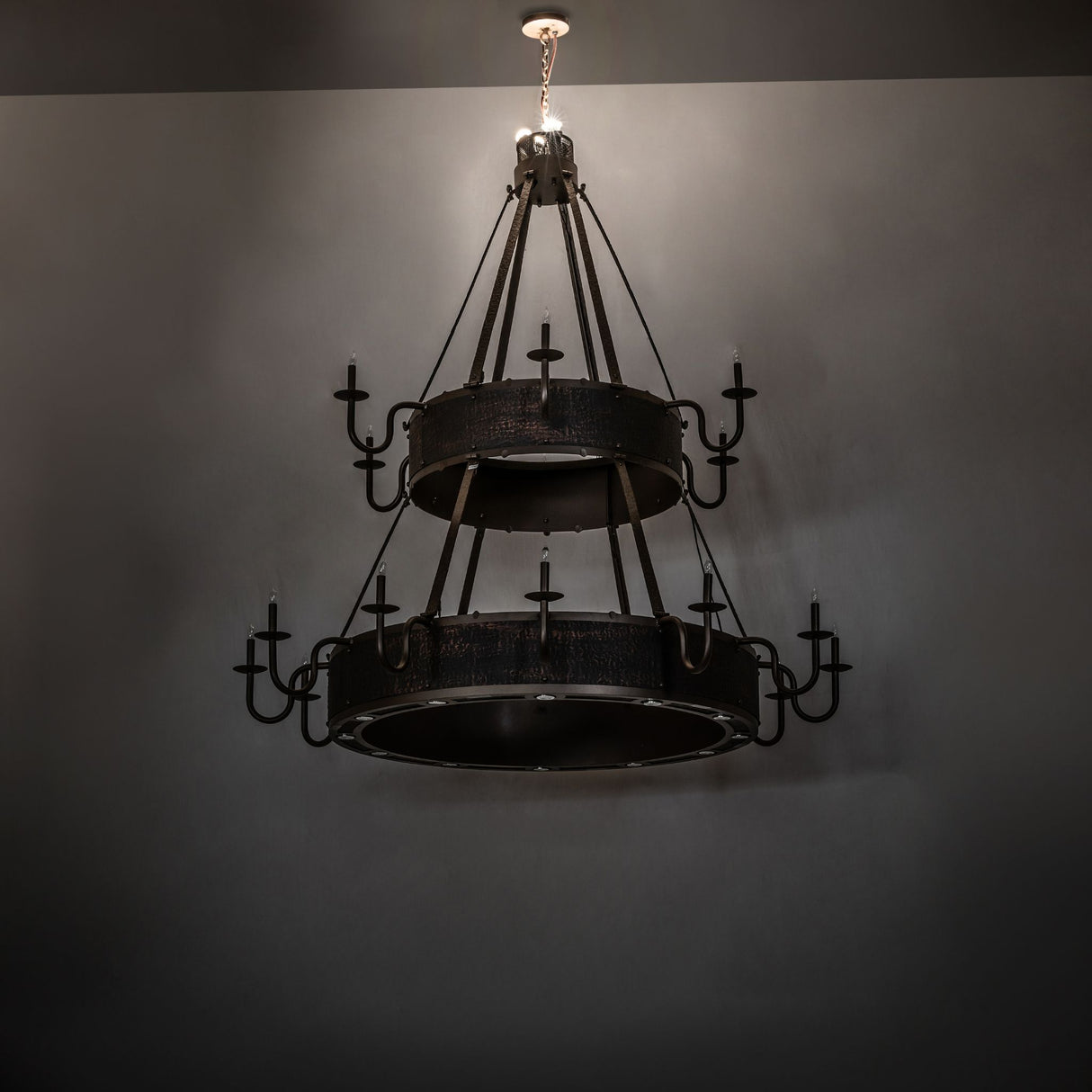 Dark Room view highlighting the Costello chandelier with upper lights illuminated.