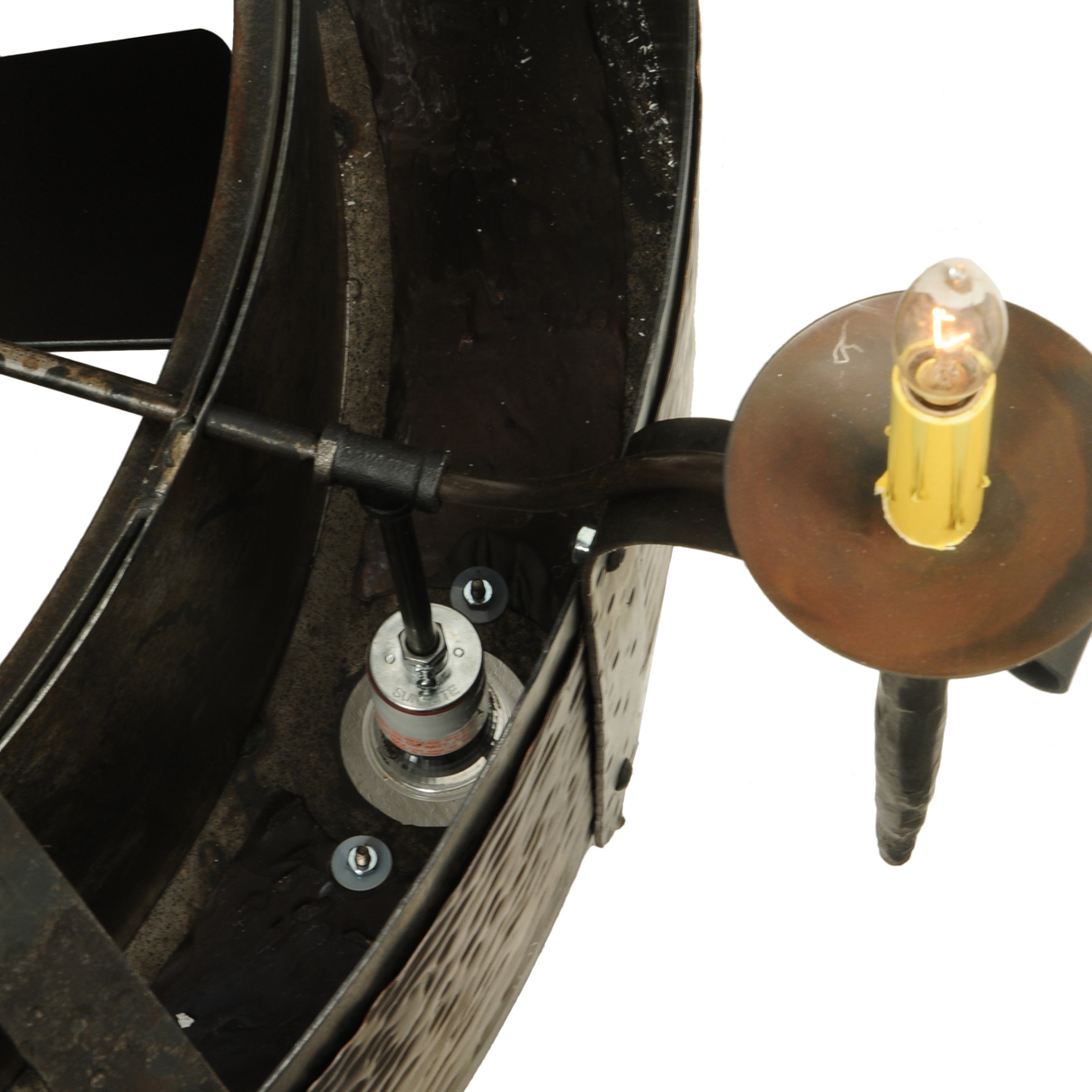 Wiring and bulb socket detail inside hammered frame.