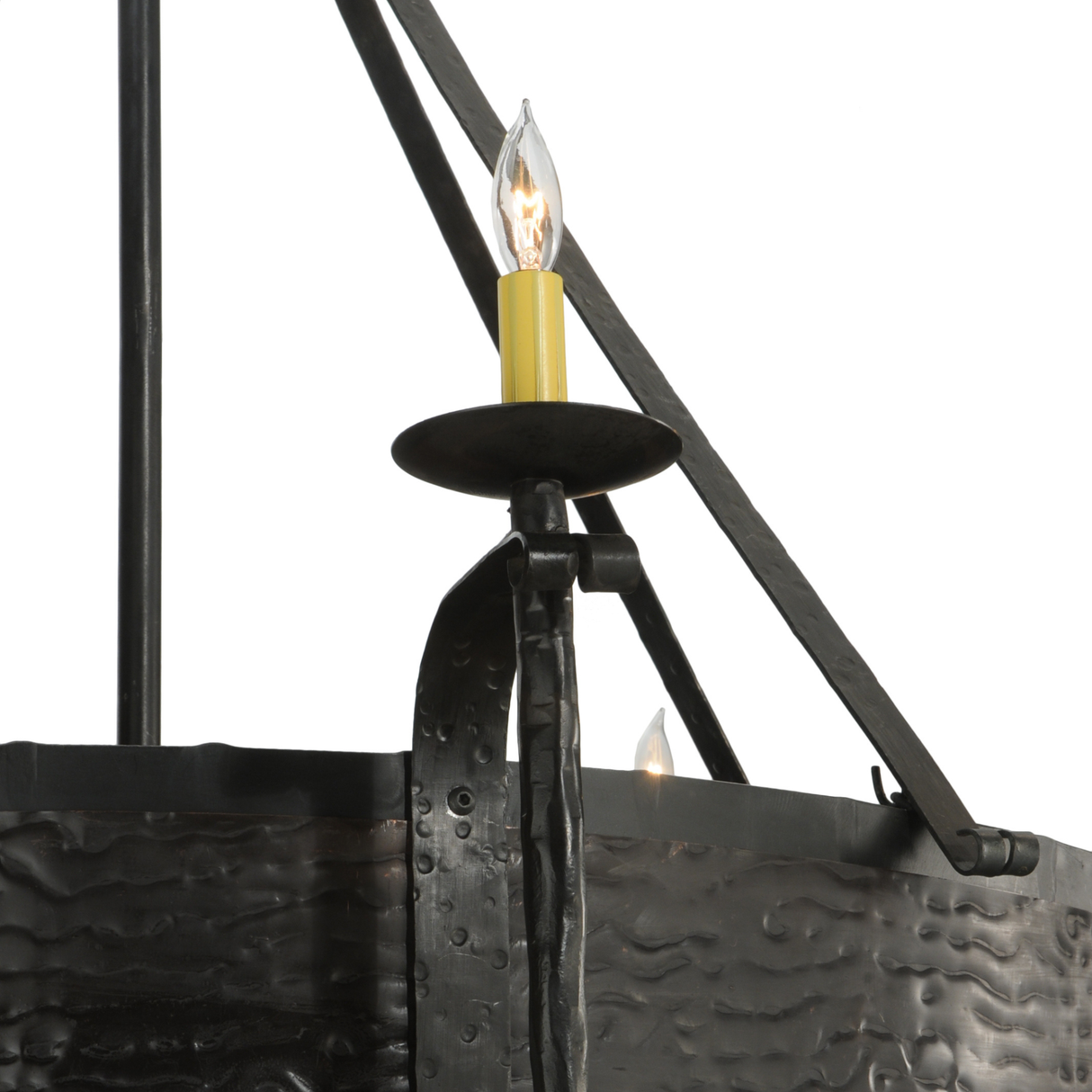 Close-up of candlelight sconce with forged iron detail.