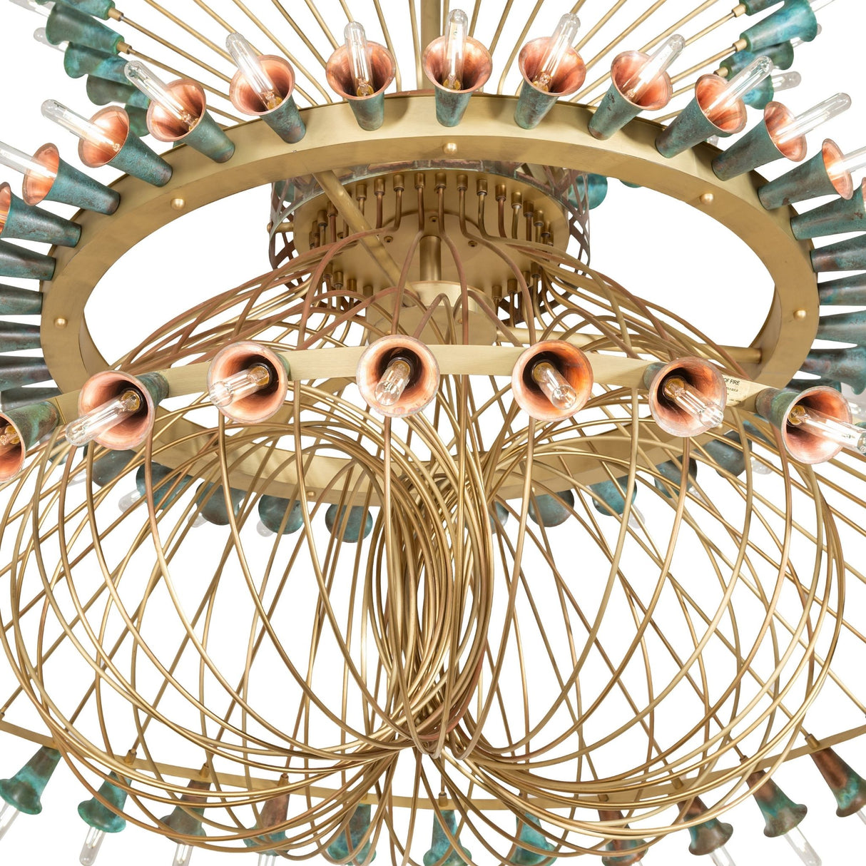 Close-up of Coyle chandelier showing brass wiring curves and copper socket details.