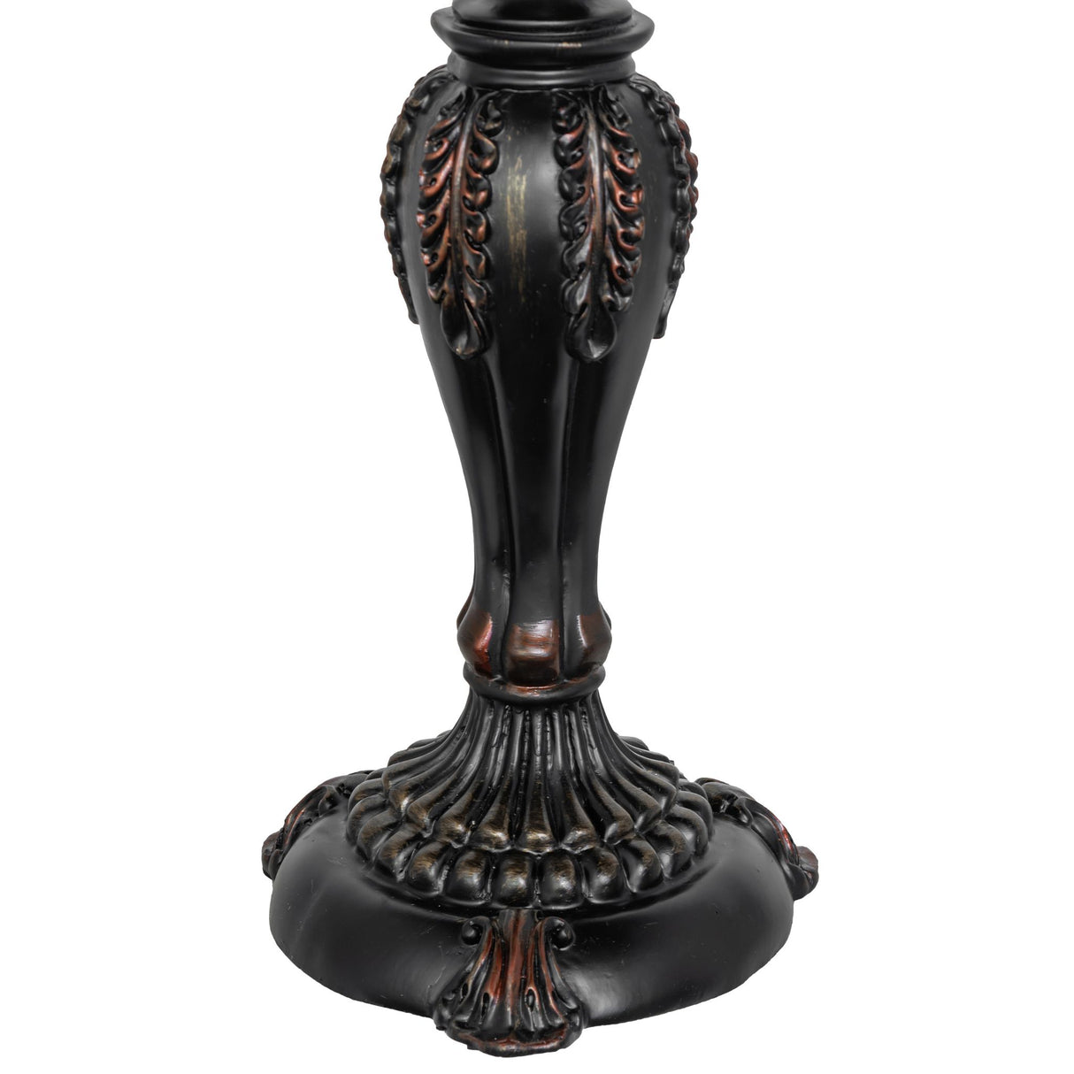 Close-up of black table lamp base with intricate leaf details.