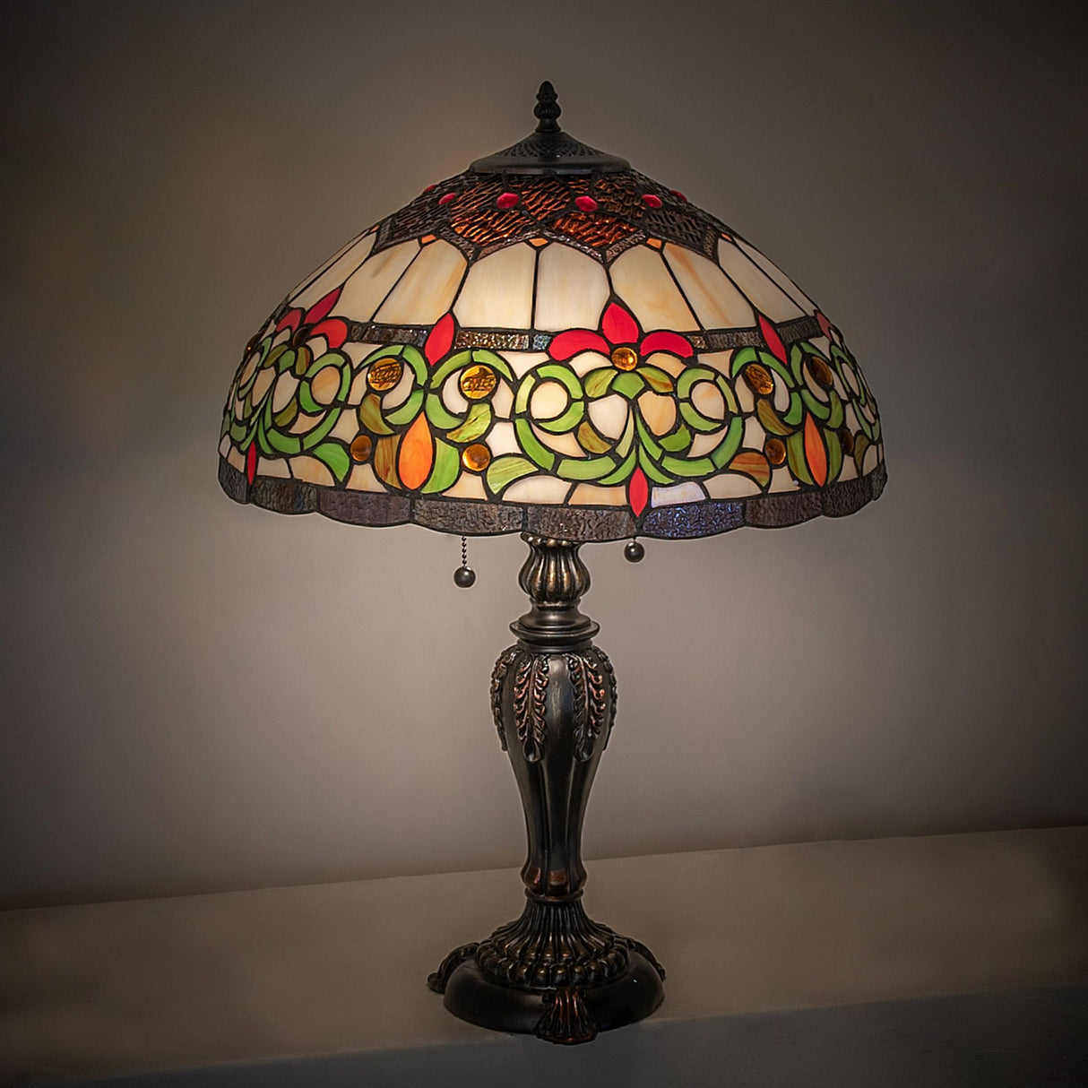 Creole table lamp glowing warmly in a dark room.