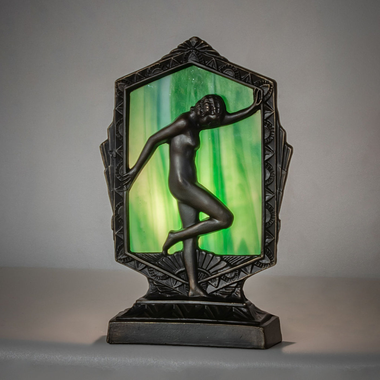 Illuminated Deco Posing Lady accent lamp with a glowing green ripple glass panel.
