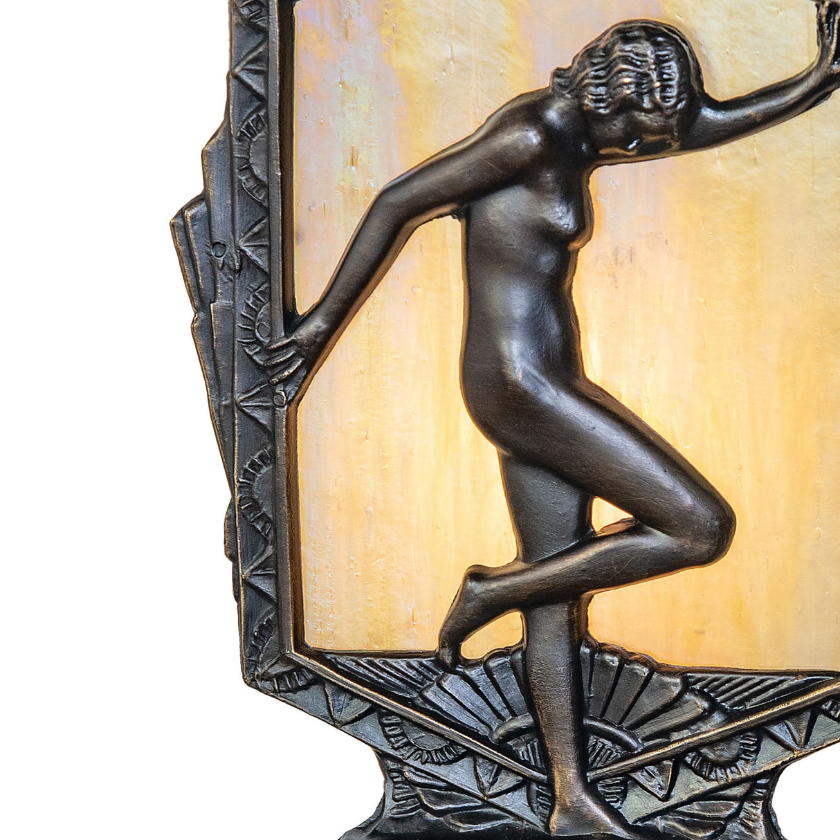 Close-up of Deco posing lady lamp highlighting intricate brass detailing and textured glass panel.