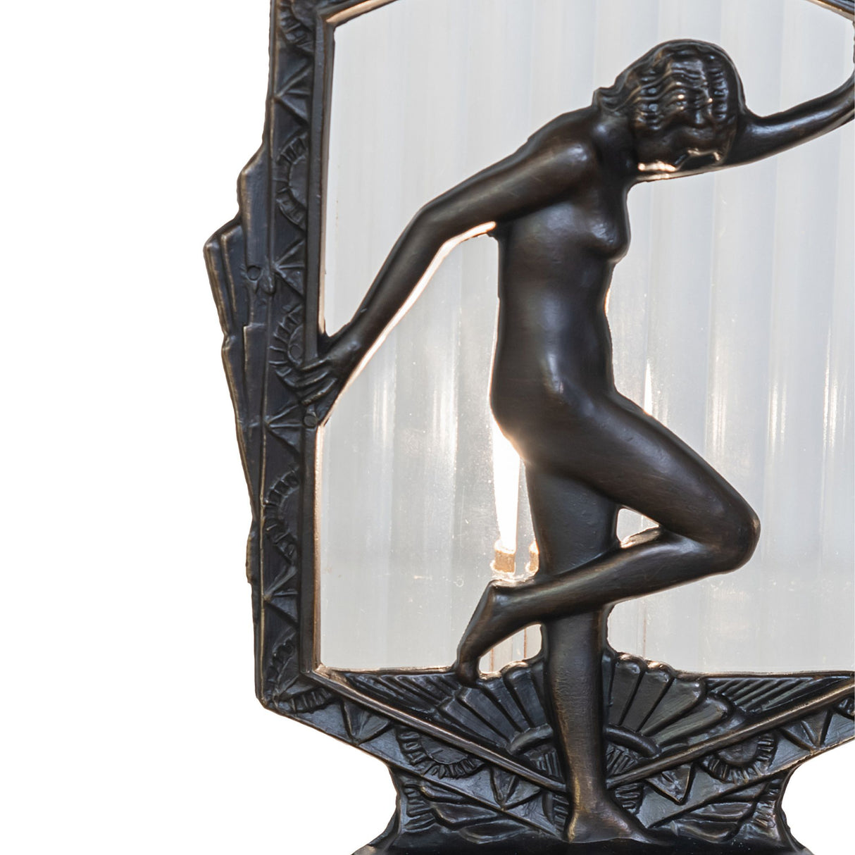 Close-up of Deco Posing Lady Accent Lamp showcasing antique brass finish and clear fluted glass.