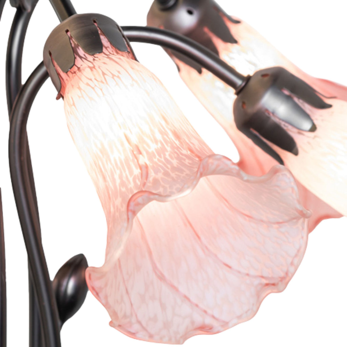 Close-up of pink lily glass shade and metal details.